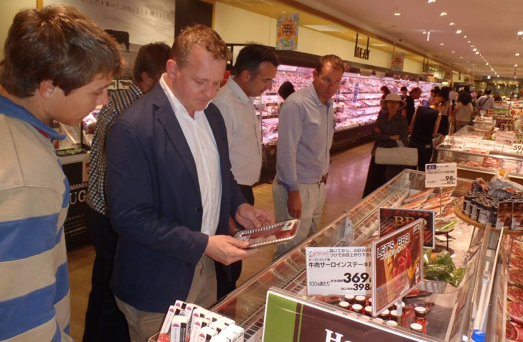 CLOSE UP: ANZ agribusiness delegation members checking out Australian product in a Tokyo supermarket with Meat and Livestock Australia's Japan regional manager, Andrew Cox.