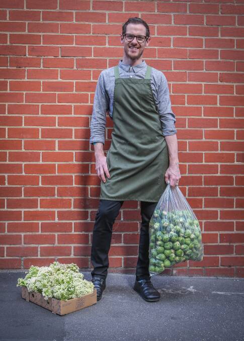 SPROUTING UP: Chef Nate Wilkins with vegetables he uses in the popular vegetarian dishes at Higher Ground restaurant in Melbourne’s central business district.