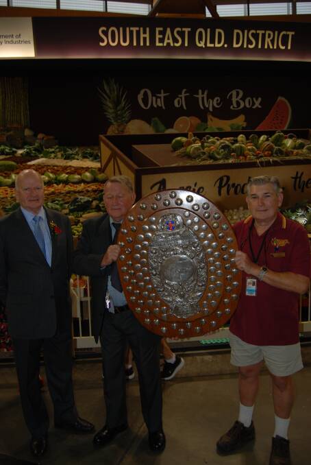 Royal Agricultural Society of NSW president Robert Ryan with Col Dabelstein, Glasshouse Mountains, Qld, his brother, Lester, Brisbane, and the winners' trophy.
