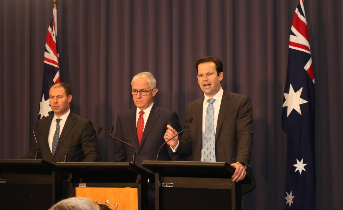 POWER ON: Environment and Energy Minister Josh Frydenberg (left), Prime Minister Malcolm Turnbull and Resources and Northern Australia Minister Matt Canavan at Tuesday's announcement in Canberra of a new energy policy push by the government.