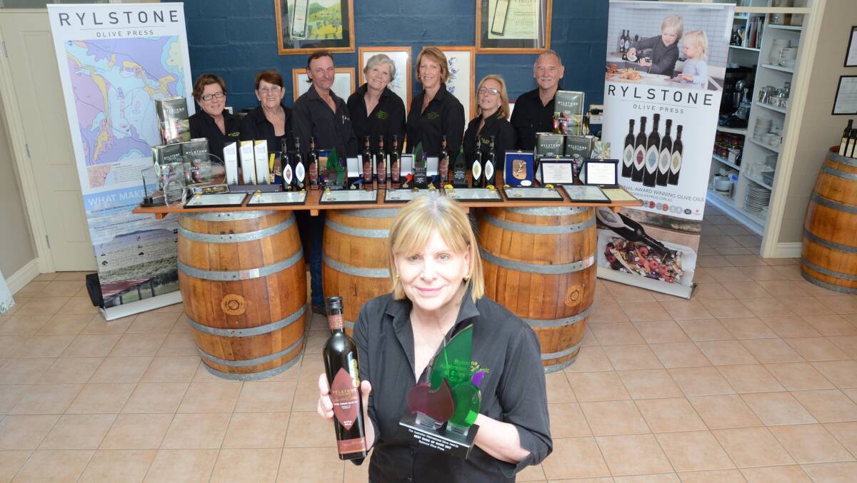 Rylstone Olive Press team headed by Jayne Bentivoglio display their awards from shows in Australia and New York.