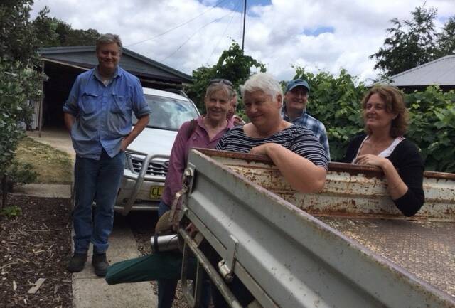 GET TOGETHER: Members of the Braidwood Garlic Growers co-op prepare to load up their bulk consignment. The group is finding success through collaboration via the Farming Together program. 