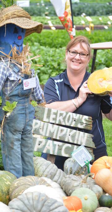 TOP DISPLAY: Lefroy Valley's Kym Prior with Leroy the scarecrow as part of the company's award-winning display at the National Horticultural and Innovation Expo.