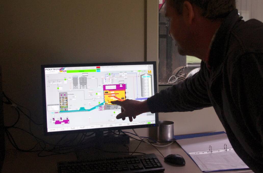 ONLINE MONITORING: Andrew Bayley checks the fully integrated software for the boiler and heating system. He can also check details from his smartphone.