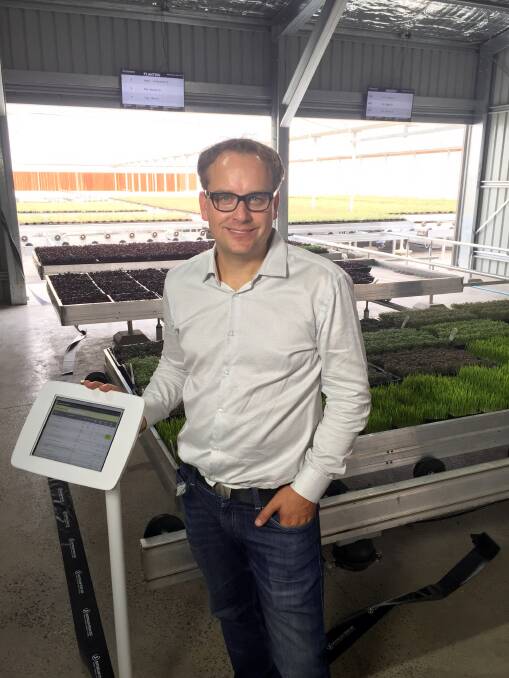 SCREEN SAVER: Australian Fresh Leaf Herbs co-founder Jan Vydra with one of the cloud technology screens designed to increase yields by about 75 per cent.​