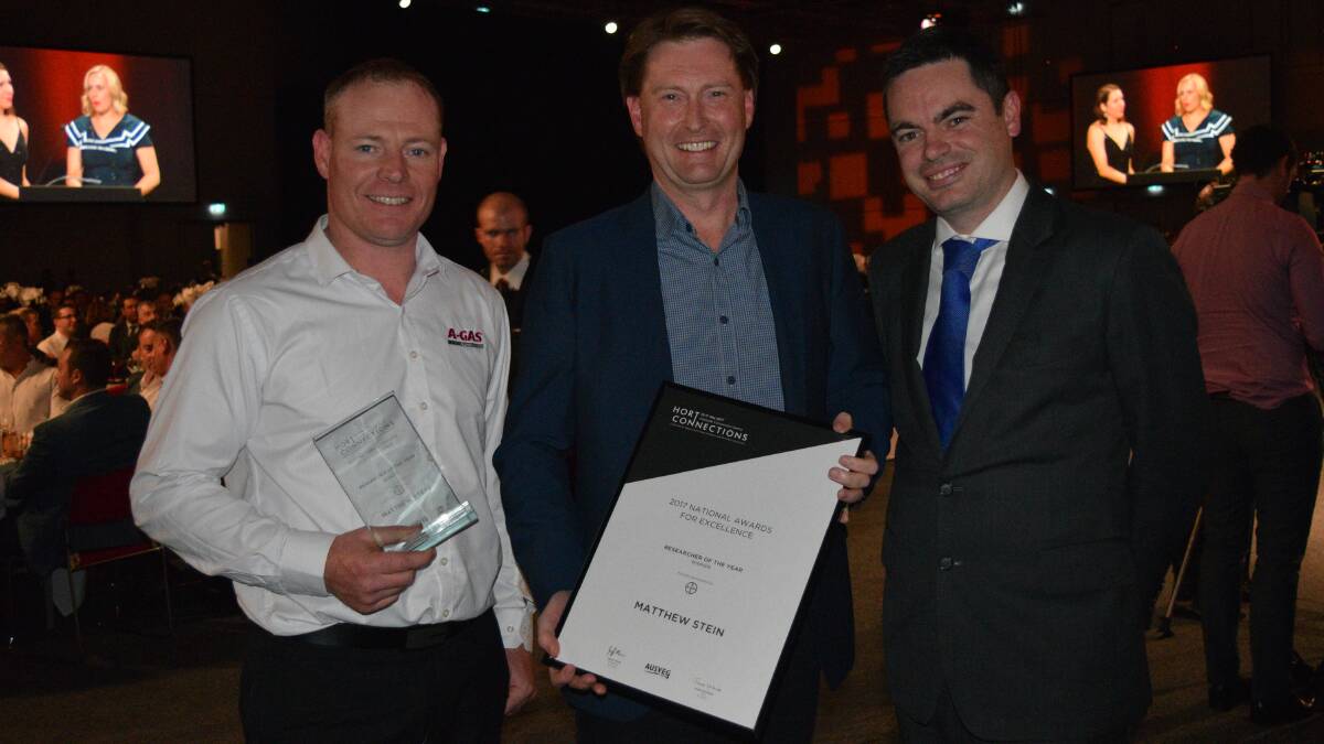 A-Gas Rural's Ben Dewit and general manager, Matthew Stein, with Bay'ers Peter Sullivan presenting the Matthew with the Researcher of the Year award for research into new soil fumigation technologies. 
