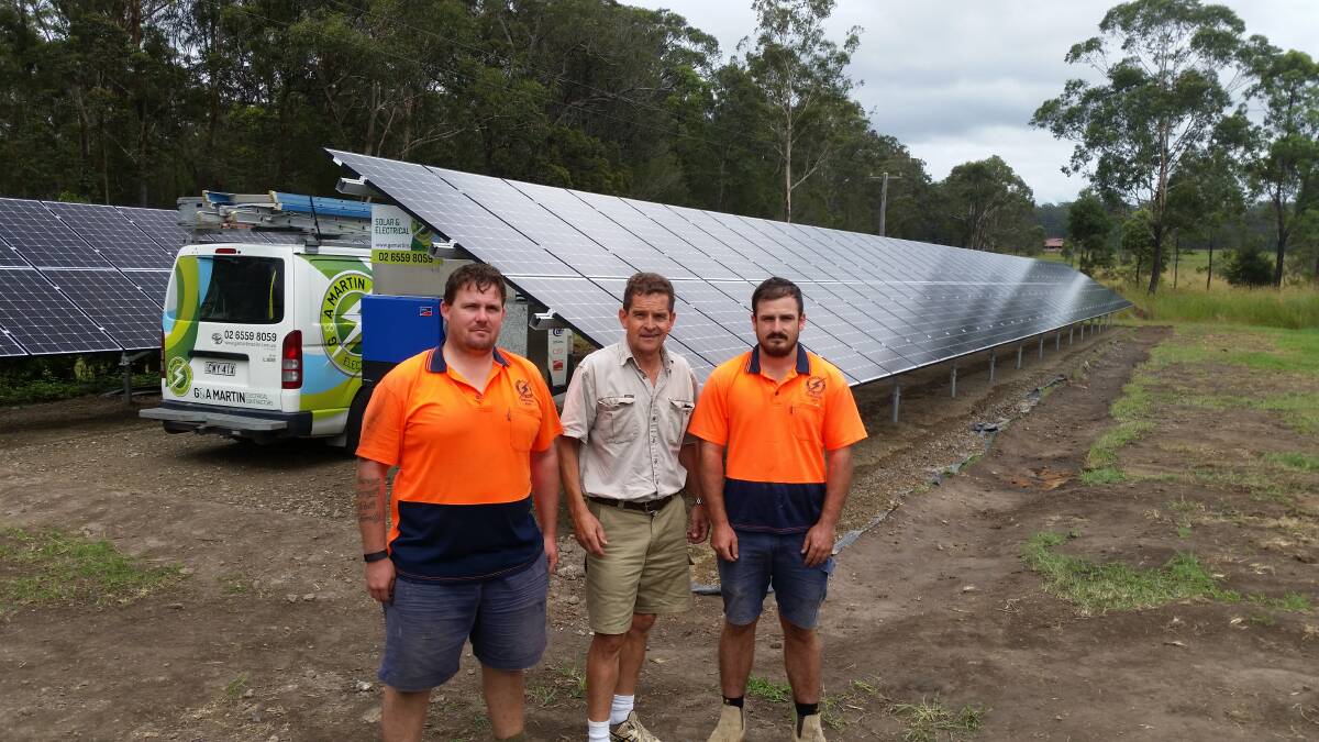 Ricardoes’ Anthony Sarks, centre, with Keith Quince and Jake Kingston from G & A Martin Solar with two banks of the 180 panels under construction.