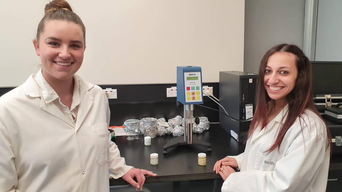 CLEVER: Charles Sturt University pharmacy students Mollie Gersbach and Haidy Ibrahim at work in the lab. Photo: supplied