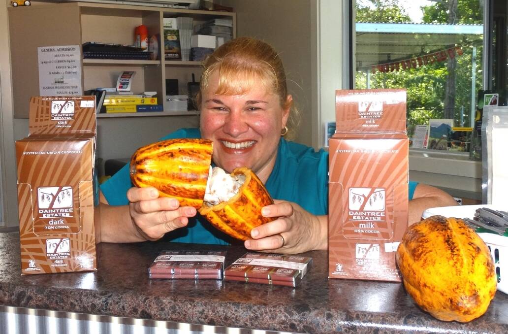 Terese Puglisi with a cocoa seed pod and some of the company’s chocolate range. 
