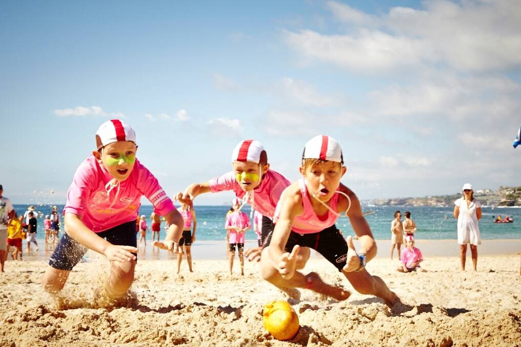 North Bondi nippers dive toward the goal; a mango instead of a beach flag, at this year’s Mess-tival.