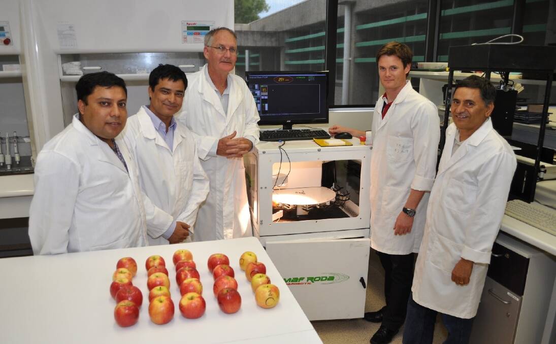 Representing fruit grading manufacturer MAF RODA Cyril Blanc (second from right) inspects some of the fruit quality scanning technology being developed by CQUniversity’s Umesh Acharya, Bed Khatiwada Prof Kerry Walsh and Dr Phul Subedi.