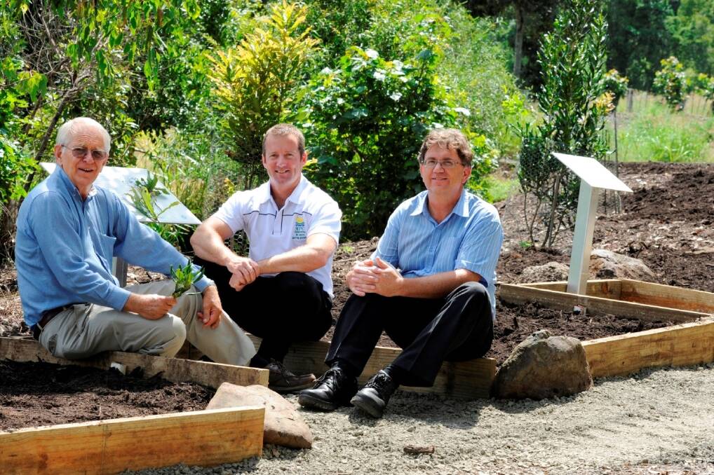 Local macadamia grower Bill Moorehouse with MPC general manager Steven Lee and MMI general manager Larry McHugh at the Lismore Rainforest Botanic Gardens where the four species of macadamia are planted.