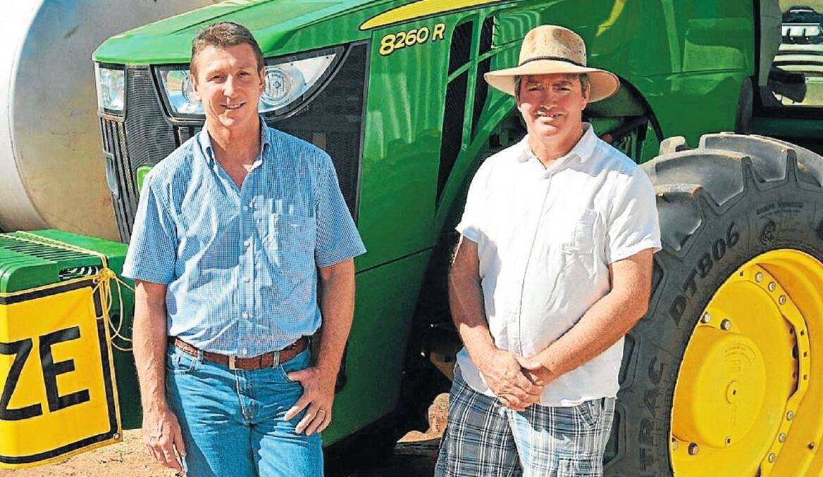 NT primary industry and fisheries Minister Willem Westra van Holthe outlines the government’s assistance plan for watermelon producers impacted by CGMMV with Katherine grower Mitchell Curtis in March.
