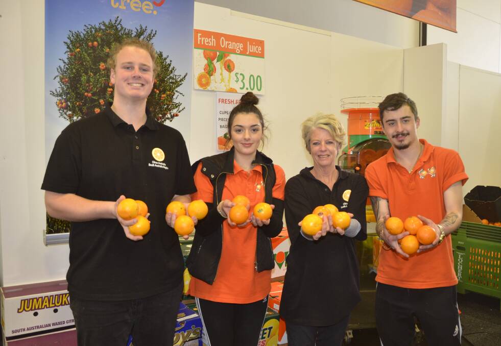 Manning the citrus stand and promoting the state's delicious produce were Ethan Hamdorf, Aisha Vassallo, Daniel Houston and Belinda Kasearu.