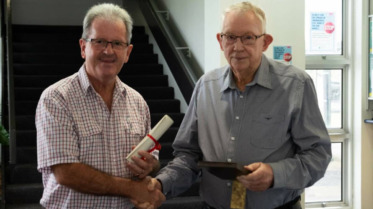 RECOGNISED: Cassowary Coast mayor Mark Nolan congratulates longtime banana industry contributor, Robert Mackay. Picture: Nicola Tams