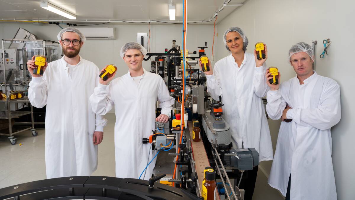 LIQUID GOLD: Hampson honey production staff Huw Zumpe, Joel Dunkley, owner Karin Hampson and Troy Marsh at the new packaging facility. Picture: Supplied.