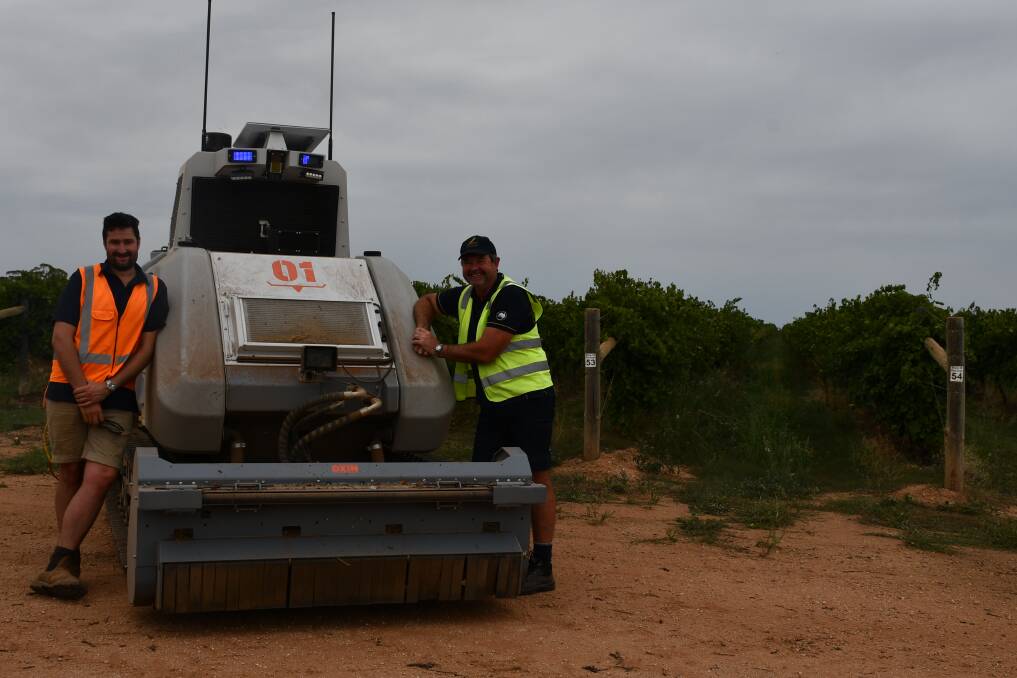 Smart Machine's Angus Cochrane and Duxton's Wayne Ellis with the OXIN autonomous tractor, which is being trialled in Duxton's Euston vineyard in NSW. Picture by Paula Thompson