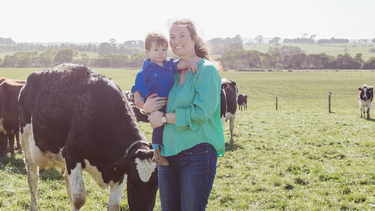Central Queensland University associate professor Amy Cosby on her dairy farm in Gippsland, Victoria, with son Oscar. Picture supplied