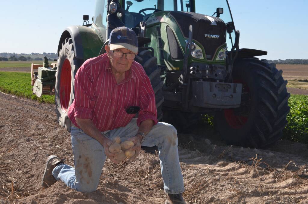 GROWING: John Bensley, Stillbrook, Crookwell with a handful of Carisma certified seed potatoes on the point of harvest.