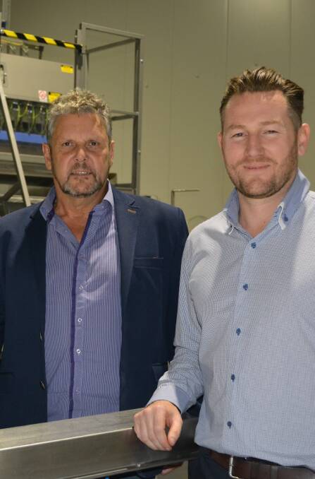 Freshmax founder and director, John Scott, Christchurch, NZ,with Valleyfresh national account manager, Adam Carville, Sydney, and new pre-packing machinery at the company's warehouse and distribution centre. 