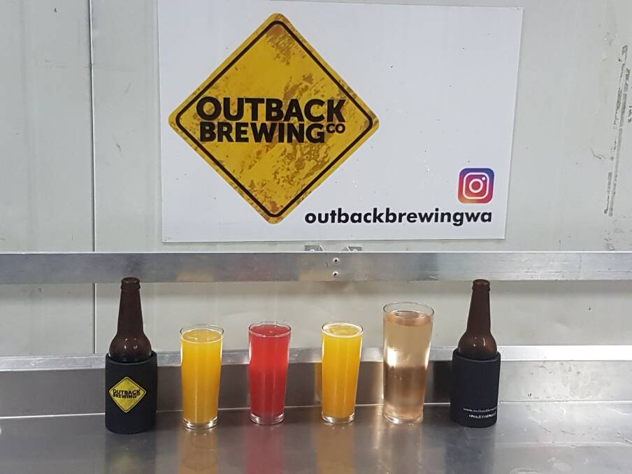 RANGE: Outback Brewing Co makes a range of ciders, including (left to right) a passionfruit cider, raspberry cider, mango cider and apple cider. The apple cider is made using the new Bravo apple variety, grown in Manjimup, which gives it a pink hue.