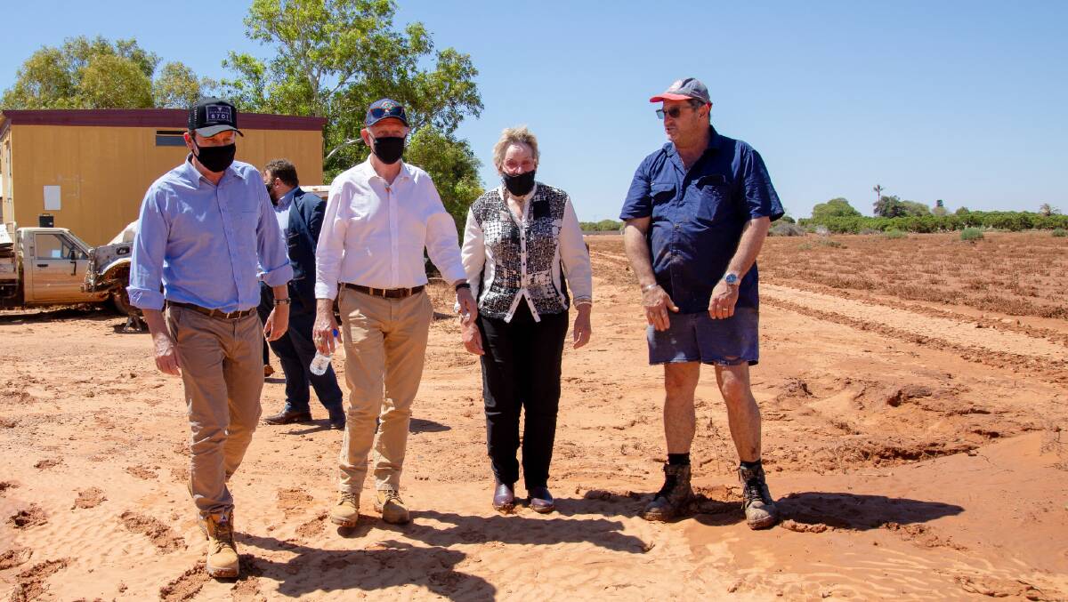 BEGINNING: Caiden plantation owner Eddie Smith (right), showS Premier Mark McGowan (left), Emergency Services Minister Fran Logan and Agriculture and Food Minister Alannah MacTiernan the damage caused to his property during the flood.
