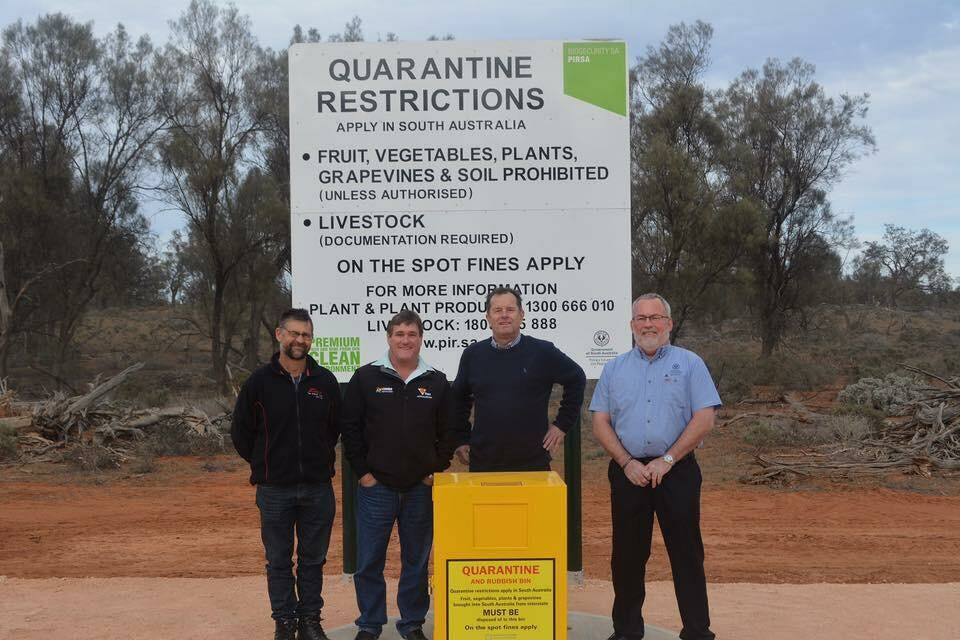 Riverland Fruit Fly Committee members - Summerfruit SA representative Jason Size and Citrus Australia SA Region chair Steve Burdette with Primary Industries Minister Tim Whestone and Biosecurity SA's Richard Schepel at one of the new quarantine bins.