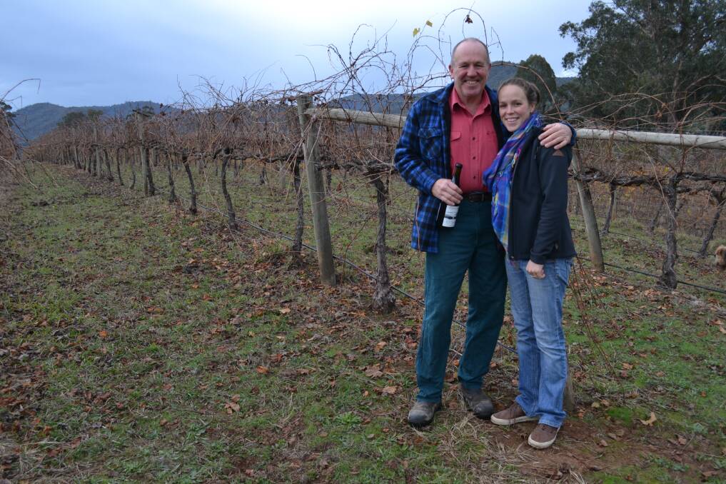 FAMILY TIES: Darling Estate Wines winemaker John Darling and his daughter Grace, among the Nebbiolo vines, will celebrate the 100th anniversary of the Darling family settling in the King Valley. Picture: JODIE BRUTON