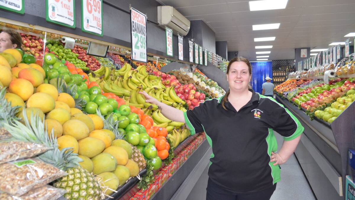 Fruit fanatic: A tough year in finding fresh fruit and veg couldn't stop Sarah Finau smiling while working at Broome's Fruit & Vegetables on Banna Avenue. PHOTO: Reuben Wylie 