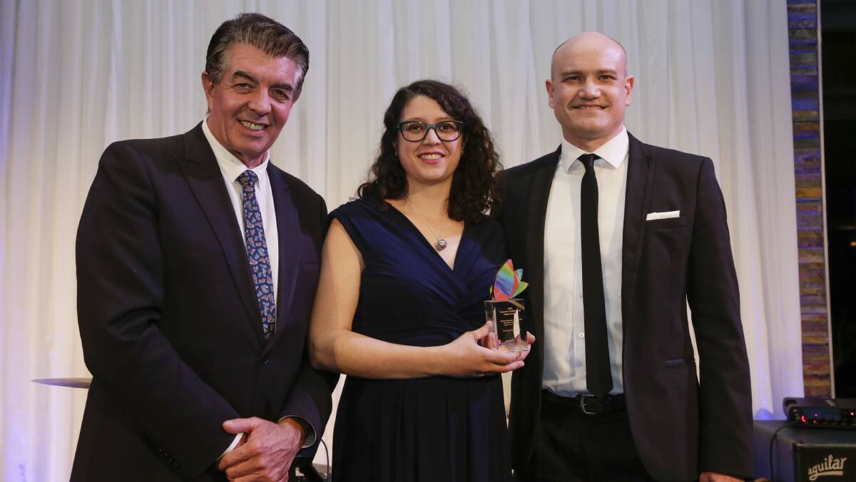 FAIR GO: Minister for Multiculturalism Ray Williams with award winners Silvia Pianelli and Michele Grigoletti from the Migrantes Foundation. PHOTO: Supplied.