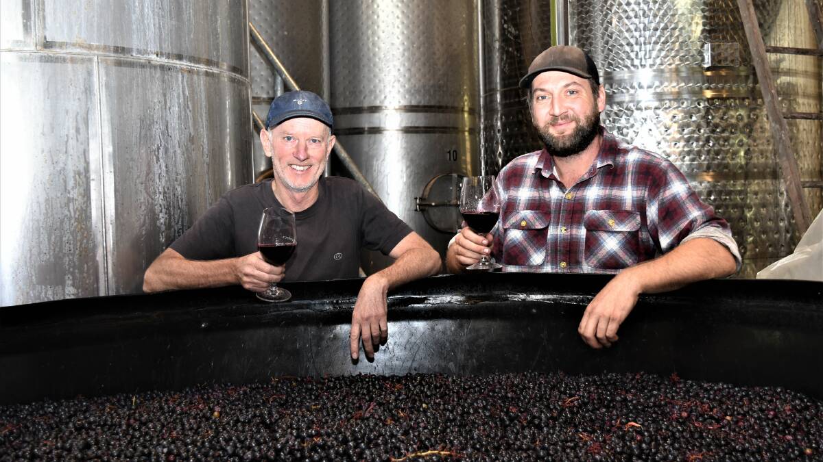 FRUIT SUPPLY: Provenance Wines' Scott Ireland and Sam Vogel inspect the process. The winery sources fruit from the Moorabool valley in Geelong and Ballarat.