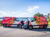 NOTICEABLE: Best mates behind Produce Drop, Homebush, NSW, Phill Lagudi and Jason McIlwaine with two of the unmissable delivery vans. 