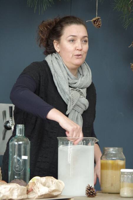 MIX UP: Sharon Flynn mixing water and sugar to make water kefir. 