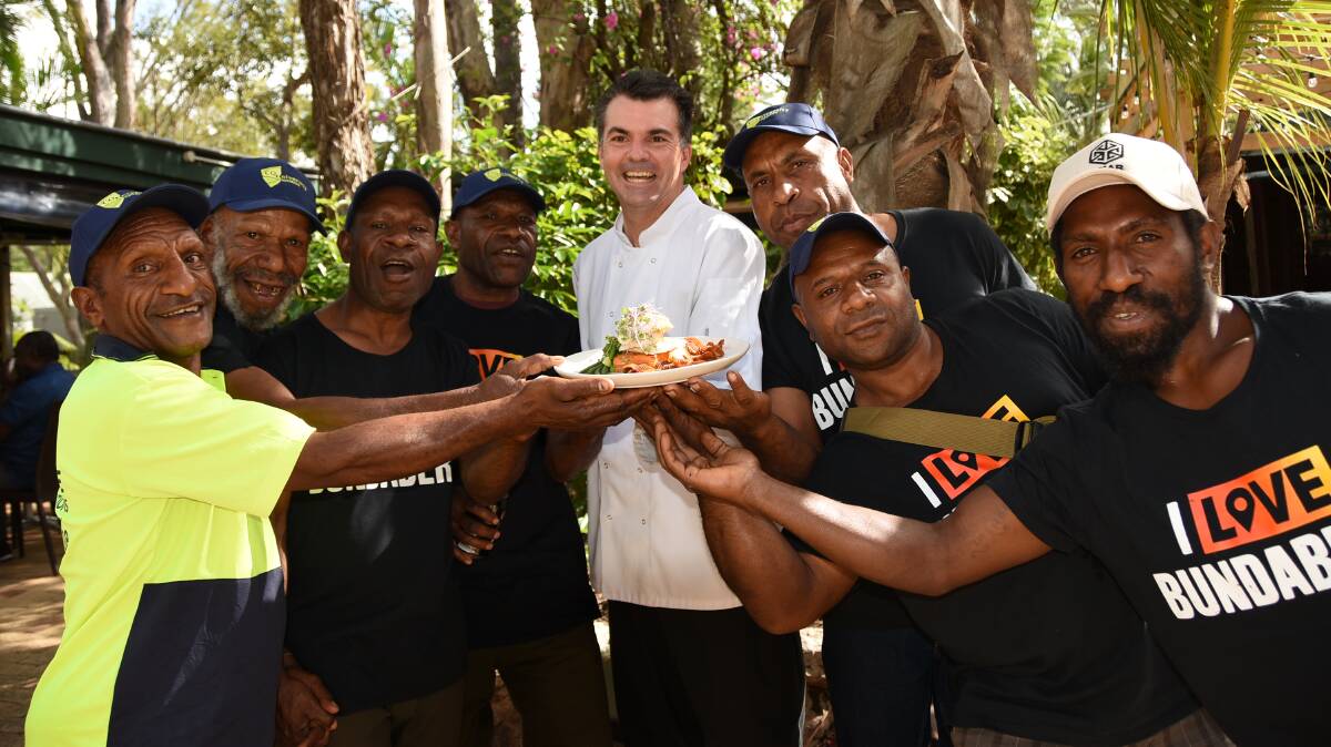 HERO DISH: Some of the Papua New Guinean sweetpotato farmers with HSG At The Gardens chef and owner, Dion Taylor (centre), and dish featuring specially prepared sweetpotato. 