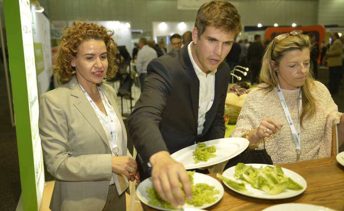 DIG IN: Rijk Zwaan retail and trade specialist, Frances Tolson (left) helps delegates with assembling their salads during Hort Connections 2018. 