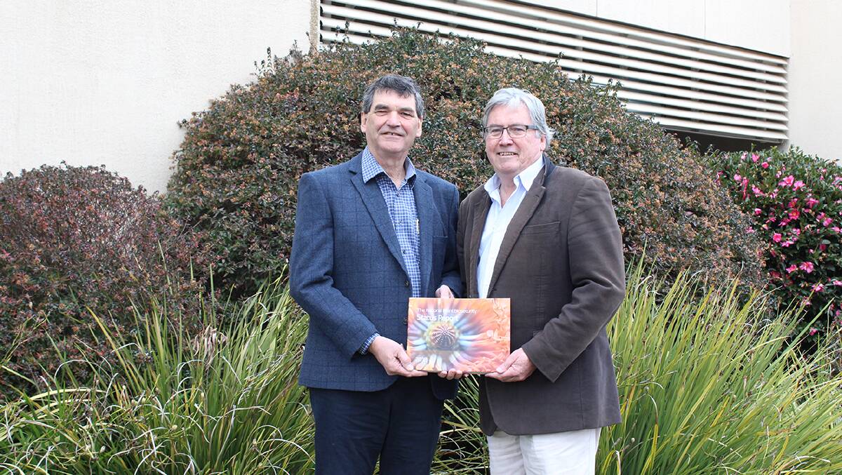 RELEASED: Plant Health Australia chair, Steve McCutcheon and executive director and CEO, Greg Fraser with the National Plant Biosecurity Status Report for 2018.
