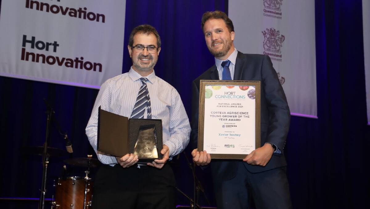 AWARD: Heinrich Van Der Westhuizen, E. E. Muir and Sons sales manager (accepting the award on behalf of Xavier Toohey) with Nick Koch, Corteva Agriscience, marketing manager. Photo: Andrew Beveridge