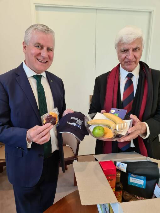 SAMPLE: Deputy prime minister, Michael McCormack, looks over some of the products produced in north Queensland with member for Kennedy, Bob Katter. 