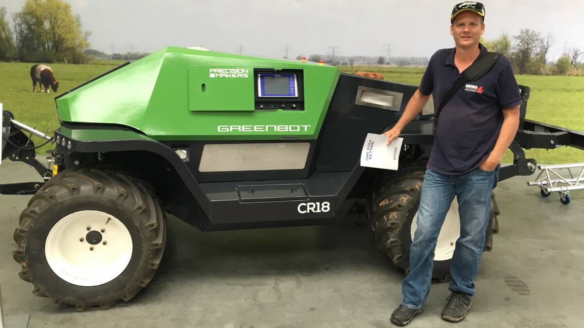 BOT: North Qld fresh produce grower, Matt Fealy, with an example of on-farm robotics in action conducting his Nuffield Scholar research trip overseas. 