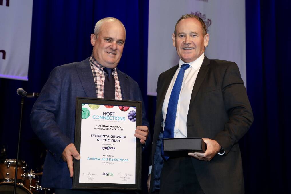 TOP: Andrew Moon, Moonrocks and G'day Garlic, St George, Qld accepting the Grower of the Year Award from sponsor, Paul Luxton, managing director, Syngenta Australia - New Zealand. Photo:Andrew Beveridge 