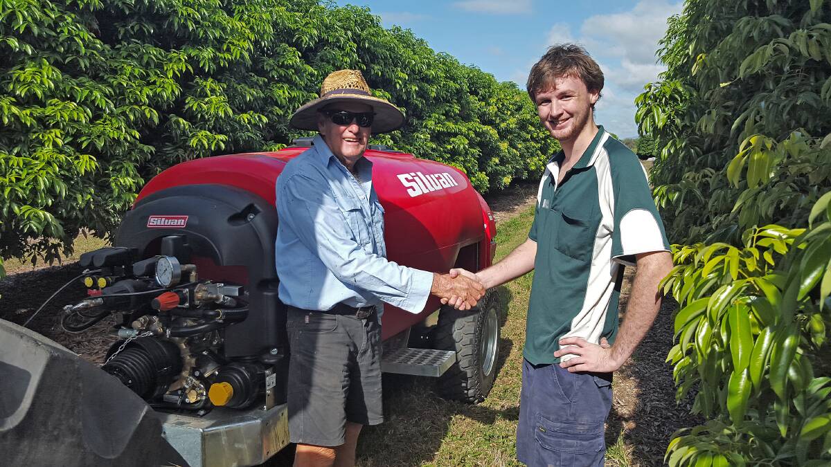 DONE DEAL: NQAS Ingham's Hamish Howarth handing over the new Silvan 2000L Supaflo sprayer to Ingham district lychee farmer, Martin Joyce. Silvan sprayers have an extensive choice of features available.