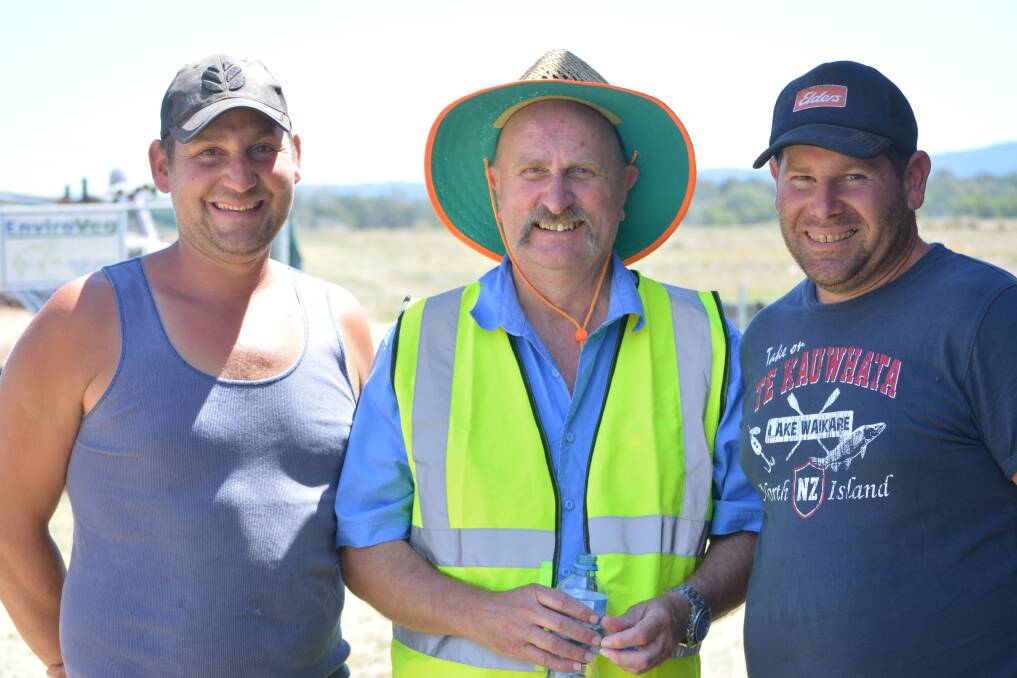 EASE BACK: Retiring NSW Local Land Services horticulturalist, Leigh James (centre) with growers Sam and Val Micallef. 