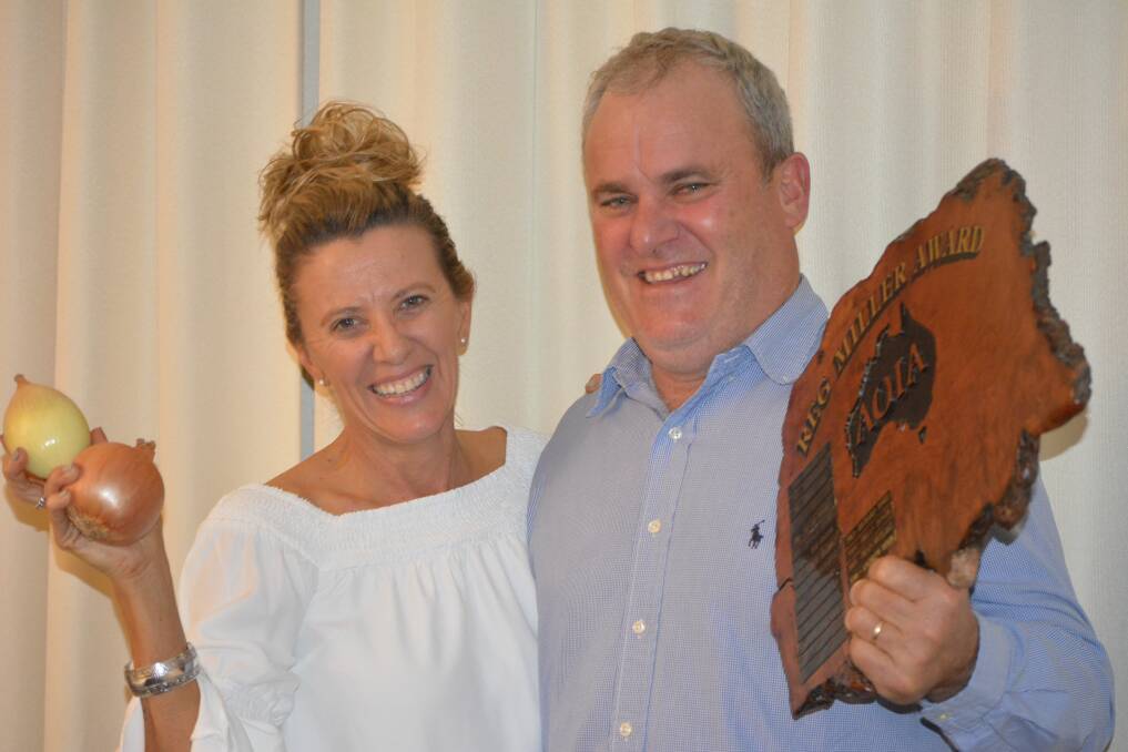 HONOURED: Queensland onion grower Andrew Moon, St George, alongside wife Kerry, with the onion industry's highest honour, the Reg Miller Award, which he was presented with last night.