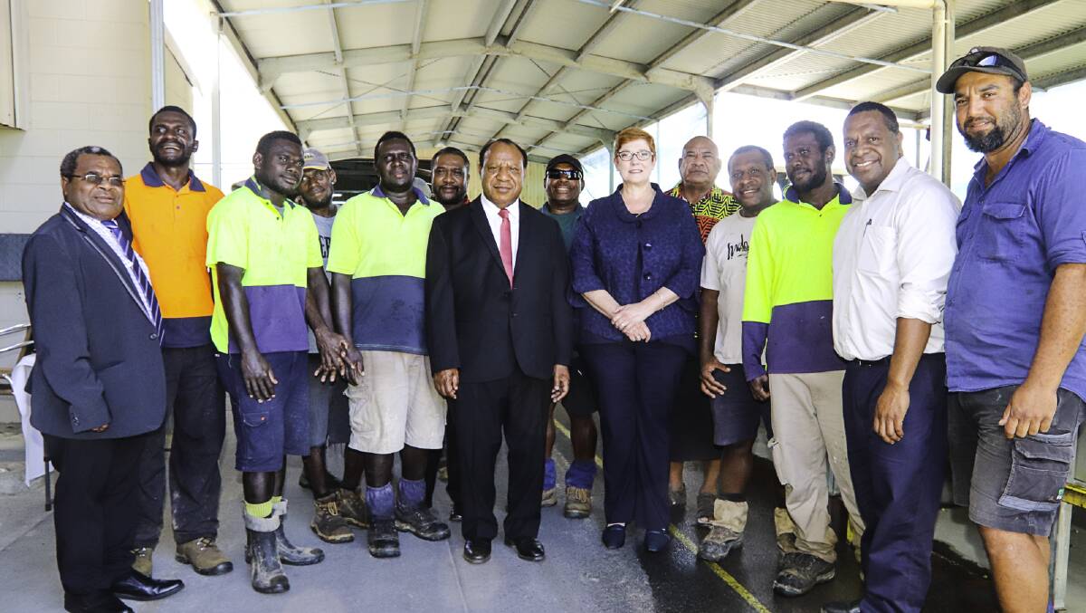 TOGETHER: Staff from Skybury Coffee in Mareeba with PNG Minister Assisting the Prime Minister William Sam (far left), PNG Foreign Minister Rimbink Pato (middle) and Federal Foreign Minister Senator Marise Payne.
