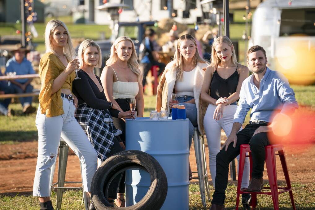CHILLIN: Farmer Matt's girls appear to be relaxed in the natural environment of rural Australia, including friendly native tyres. Photo: Channel 7.