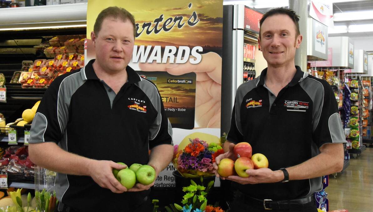 STILL GOOD: Fruit and vegetable manager, Grant Samball and assistant manager, John Kilgour of Carters Foodland Naracoorte, with fruit involved in the Hailstorm Heroes campaign.