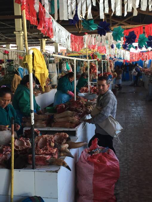 STALLS: There are plenty of different cuts of meat on offer at the markets in Cusco, including hollowed out cows head in the front left corner. 