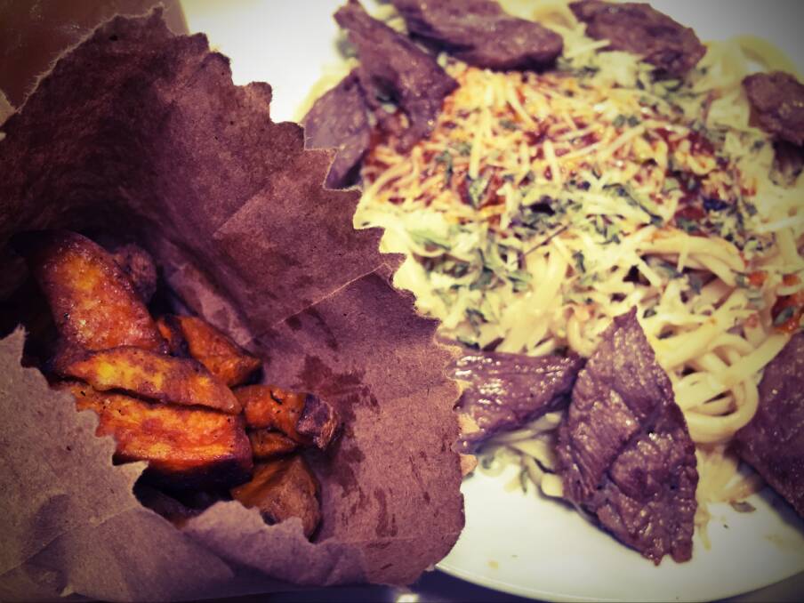 IN THE BAG: A side of soft sweetpotato chips served in a brown paper bag accompanies the Peruvian-influence spag bog, at the Lima restaurant, Viva. Note the required food blog pic filter used here again. 