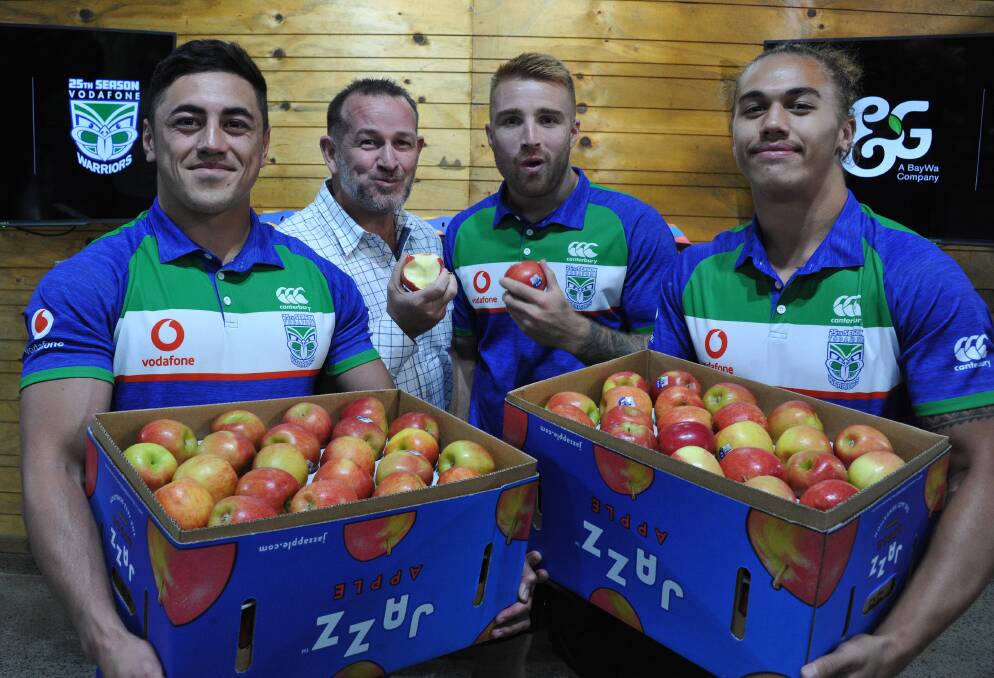EAT UP: New Zealand Warrior players, Nathaniel Roache, Adam Keighran and Chanel Harris-Tavita, with T&G managing director NZ produce, Andrew Keaney, celebrate the new sponsorship deal. 