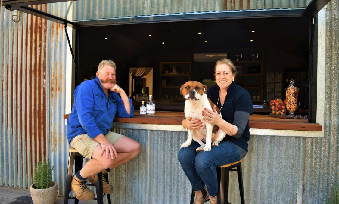 BAR TIME: Owners of The Whiskery, Russ Watson and Lorelle Warren, Bellarine, Vic with their dog, Teddy, who features on the product labels. 